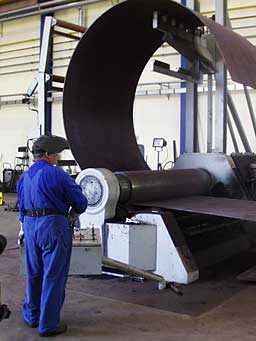 Rolling a section of a turbine tower